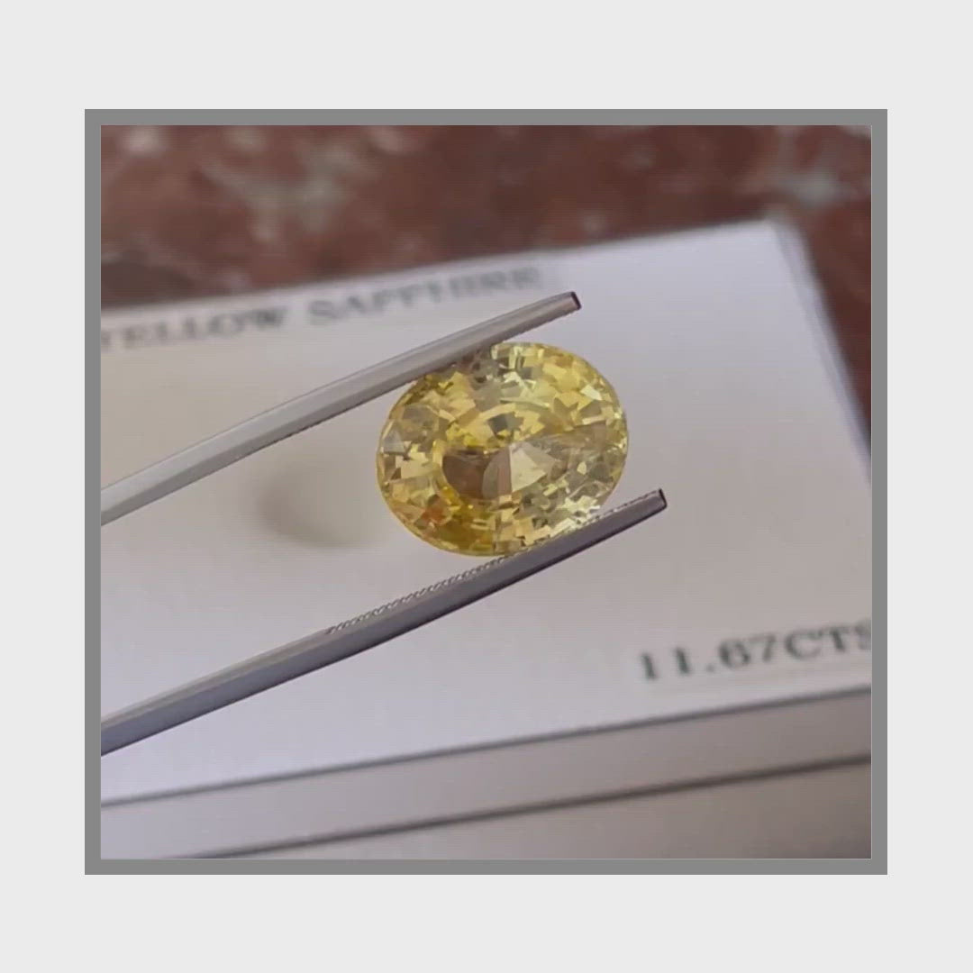 Load and play video in Gallery viewer, Natural Unheated Yellow Sapphire 11.67 Carats With GIA Report

